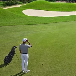 PlayBetter Garmin Approach Z82 Golf Range Finder with Slope & Image Stabilization – Bundle with Portable Charger & Towel