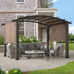 Sunjoy 10’ x 12’ Outdoor Steel Arched Pergola with Adjustable Canopy Tan